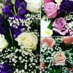 purple, pink, and peach roses