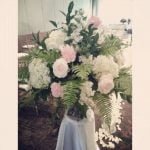 white and pink flowers with ferns